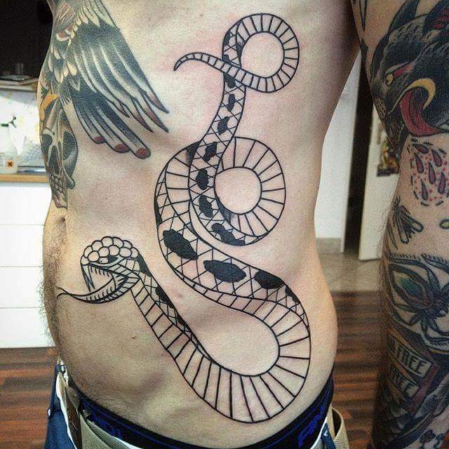 Attractive Black Ink Snake Tattoo On Man Left Side Rib