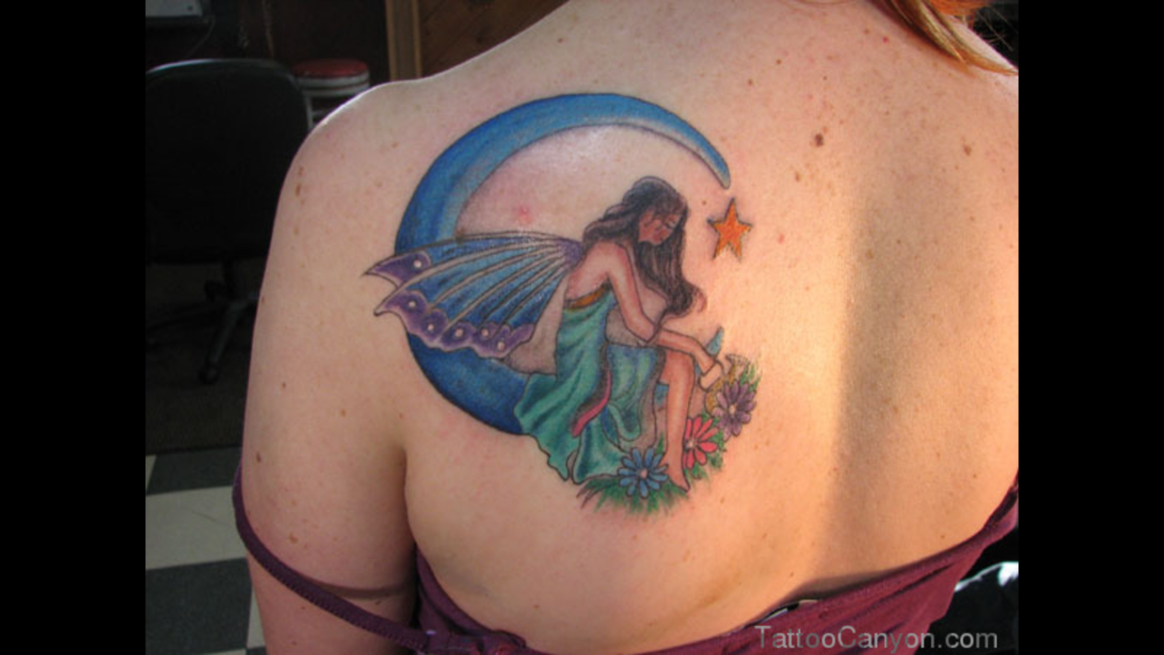 Attractive Fairy On Half Moon With Flowers And Star Tattoo On Girl Left Back Shoulder