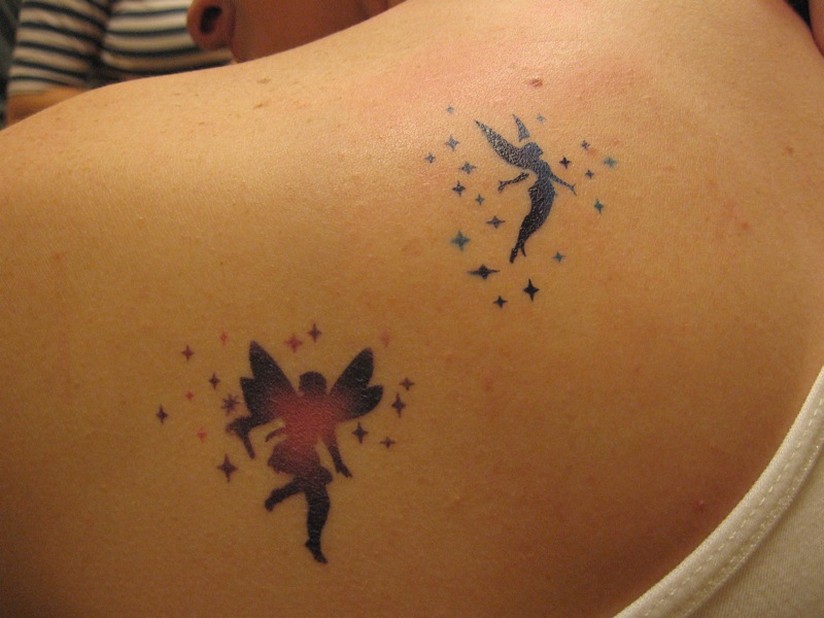 Attractive Flying Fairies Tattoo On Girl Left Back Shoulder