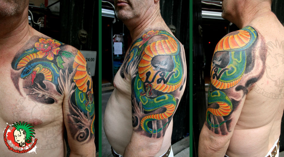 Attractive Snake Tattoo On Man Left Half Sleeve
