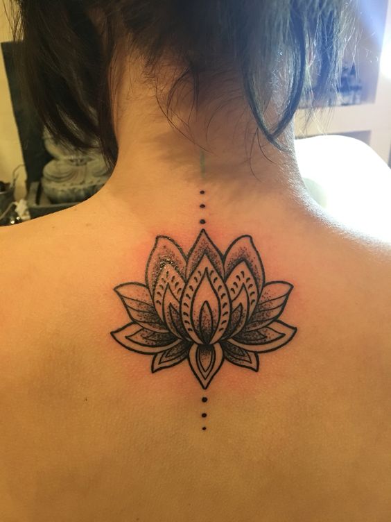 Awesome Black Ink Lotus Flower Tattoo On Girl Back Neck