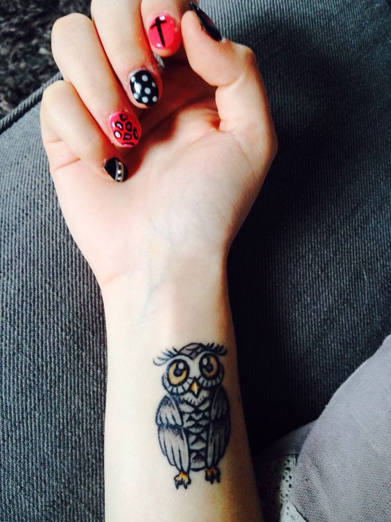 Awesome Black Ink Owl Tattoo On Girl Right Wrist