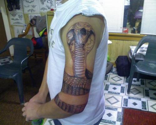 Awesome Cobra Snake Tattoo On Left Half Sleeve