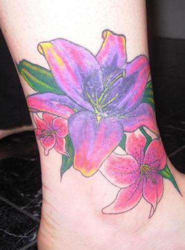 Awesome Colored Lily Tattoo On Ankle