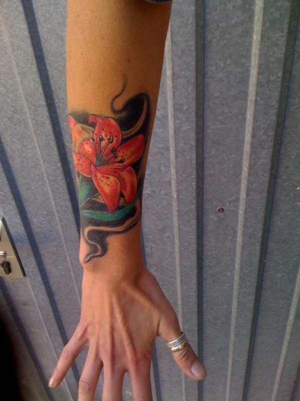 Awesome Lily Flower Tattoo On Right Upper Wrist