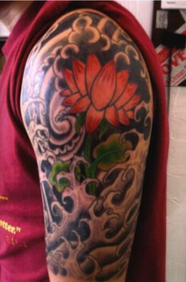 Awesome Lotus Tattoo On Man Left Shoulder