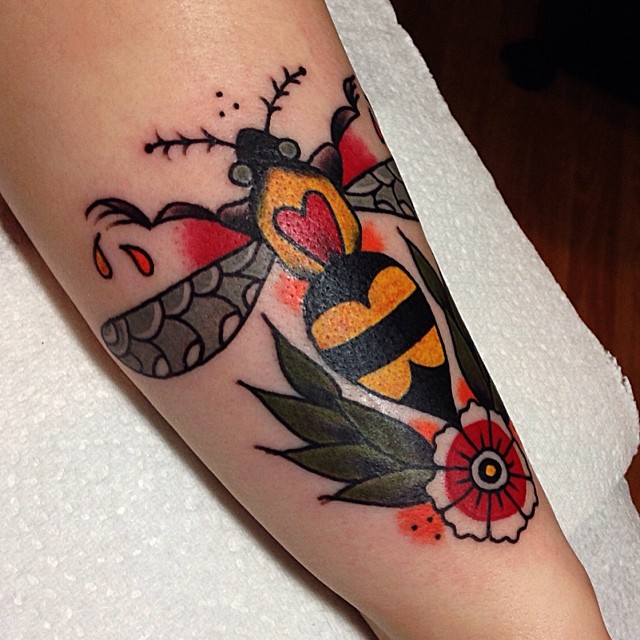 Awesome Traditional Bumblebee With Flower Tattoo Design