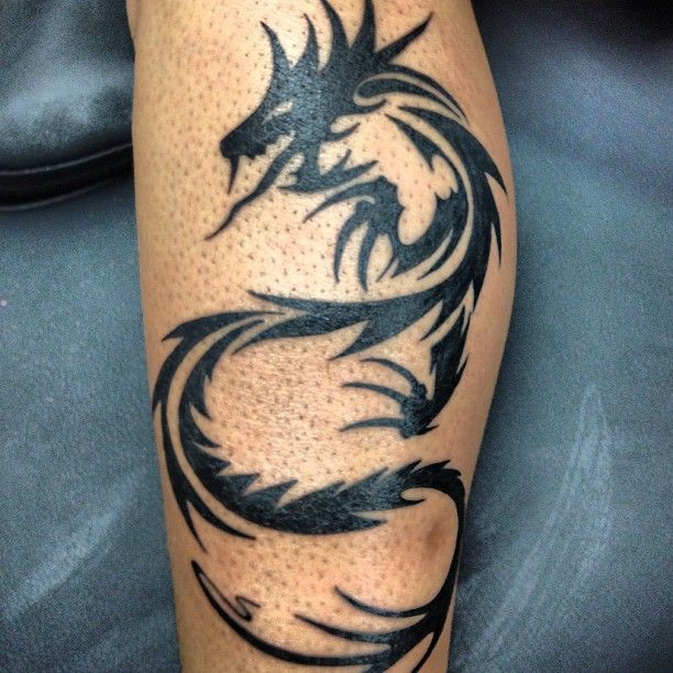 Awesome Tribal Dragon Tattoo On Leg