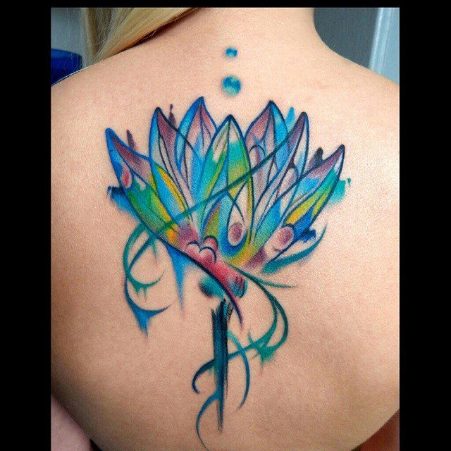 Awesome Watercolor Lotus Flower Tattoo On Girl Upper Back