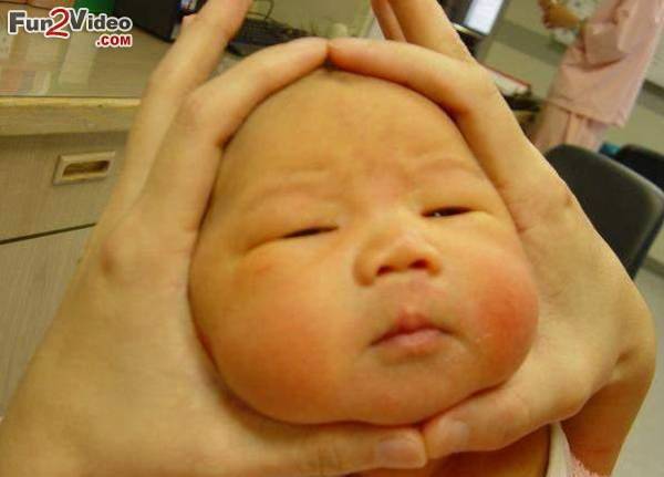 Baby Face In Fingers Funny Picture