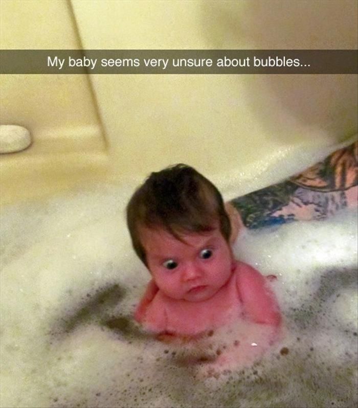 Baby Seems Unsure About Bubbles Funny Picture
