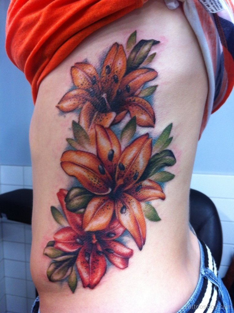 Beautiful Colored Lily Flower Tattoo On Side Rib