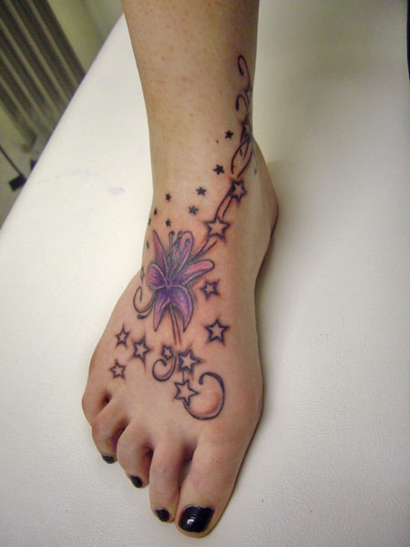 Beautiful Stars And Lily Flower Tattoo On Foot