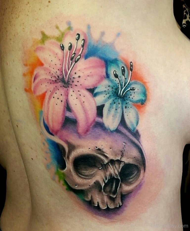 Beautiful Watercolor Lily Flower And Skull Tattoo On Side Rib