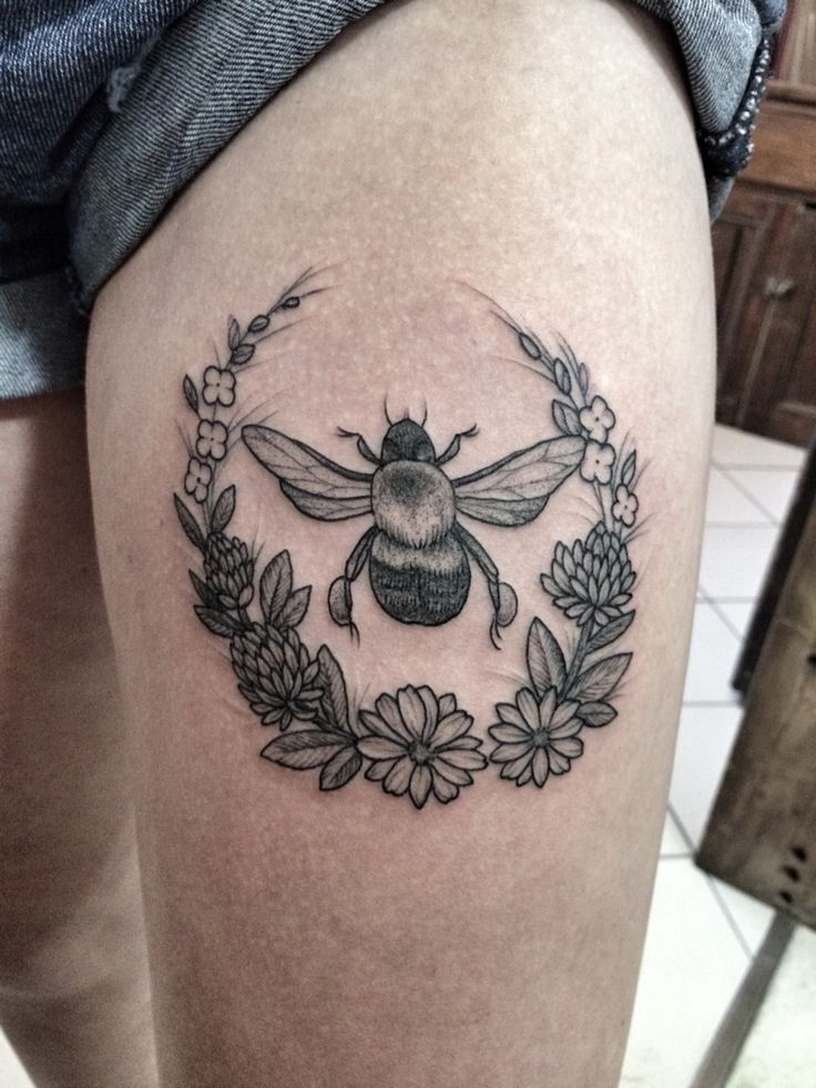 Black And Grey Bumblebee With Flowers Tattoo On Left Thigh