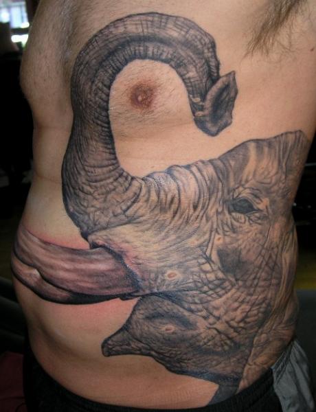 Black And Grey Elephant Head Tattoo On Man Left Side Rib