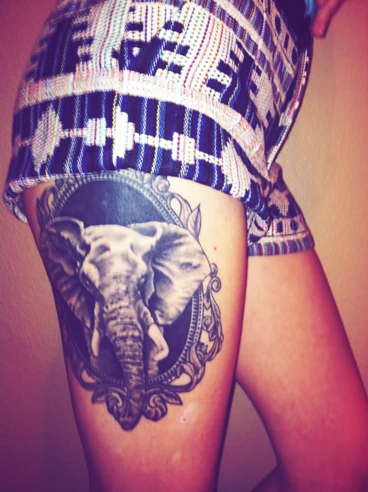 Black And Grey Elephant In Frame Tattoo On Girl Right Side Thigh