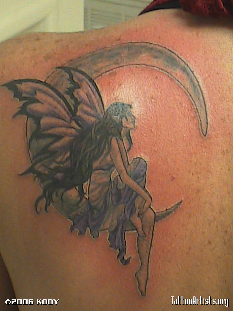 Black And Grey Fairy On Half Moon Tattoo On Left Back Shoulder