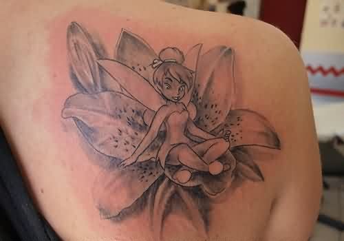 Black And Grey Fairy On Lily Flower Tattoo On Right Back Shoulder