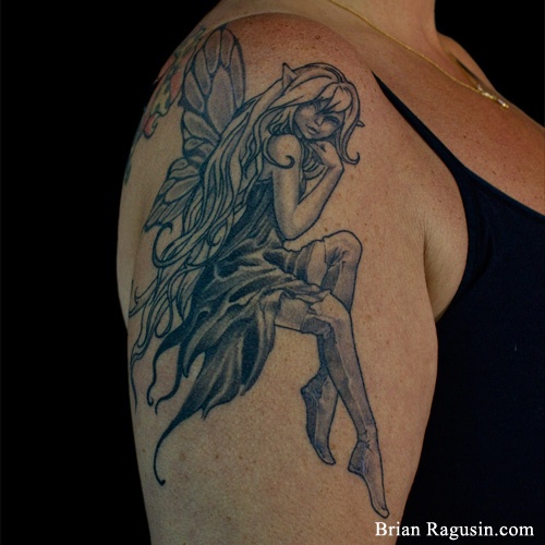 Black And Grey Fairy Tattoo On Women Upper Arm By Brian Ragusin