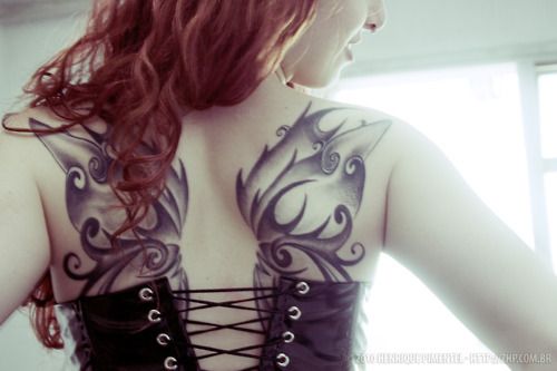 Black And Grey Fairy Wings Tattoo On Girl Upper Back
