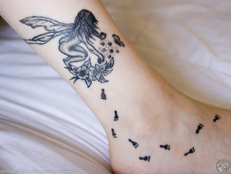 Black And Grey Fairy With Flowers Tattoo On Right Ankle
