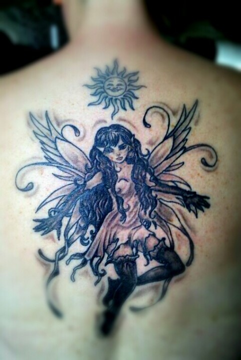 Black And Grey Flying Fairy Tattoo On Upper Back