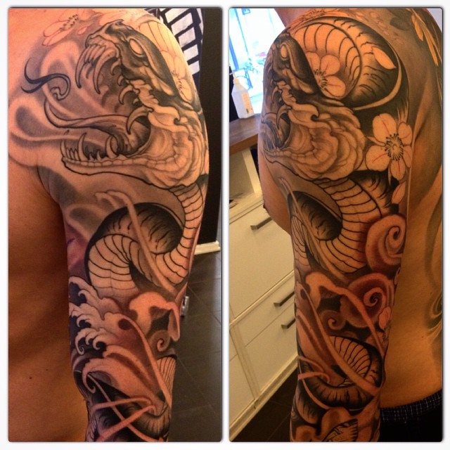 Black And Grey Japanese Snake Tattoo On Man Left Half Sleeve By Johan Finne