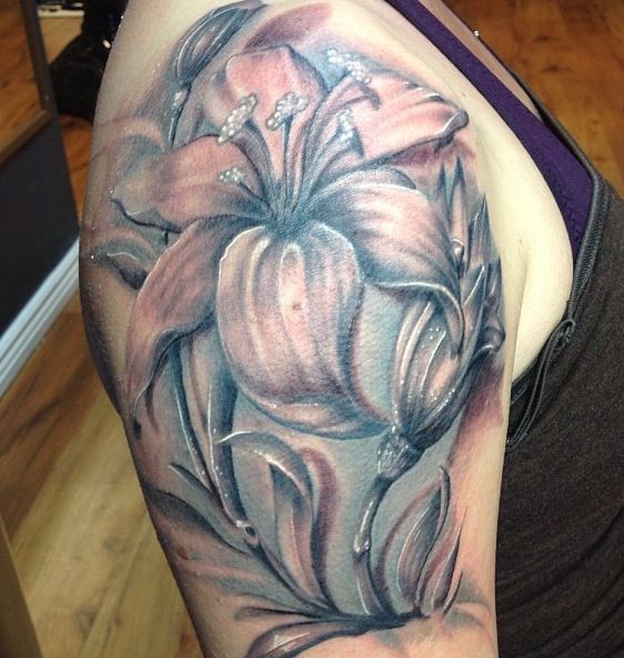 Black And Grey Lily Flower Tattoo On Right Upper Arm