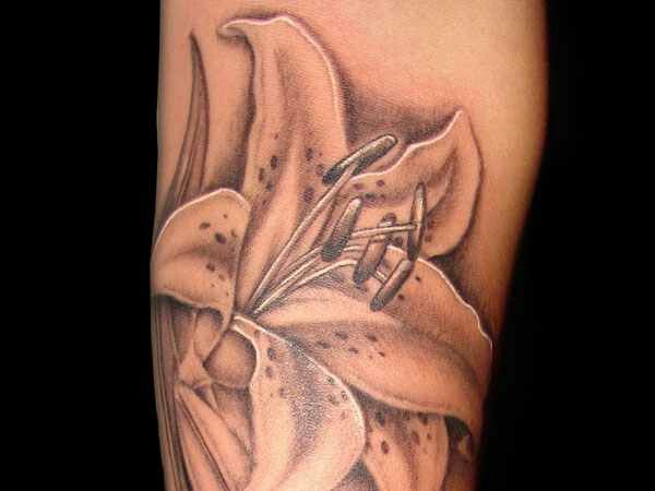 Black And Grey Lily Flower Tattoo On Sleeve