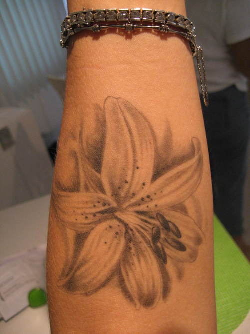 Black And Grey Lily Tattoo On Forearm