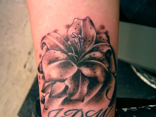 Black And Grey Lily Tattoo On Right Arm