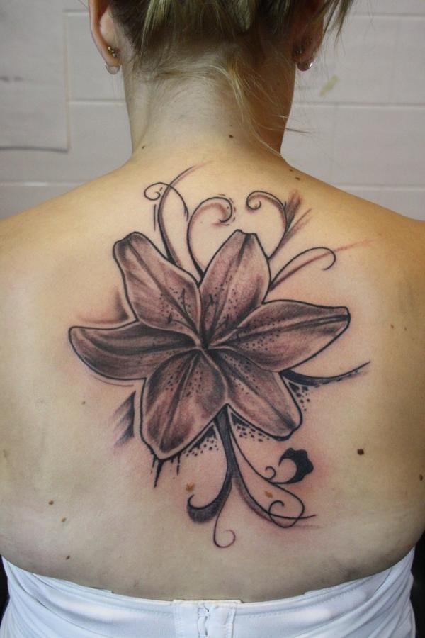 Black And Grey Lily Tattoo On Upper Back For Women