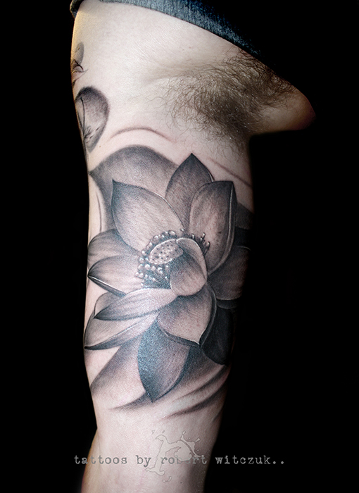 Black And Grey Lotus Flower Tattoo On Bicep