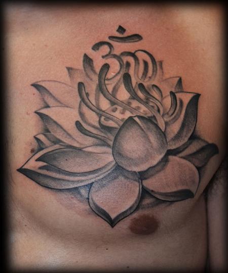 Black And Grey Lotus Flower Tattoo On Man Chest