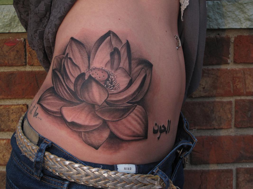 Black And Grey Lotus Flower Tattoo On Right Side Rib