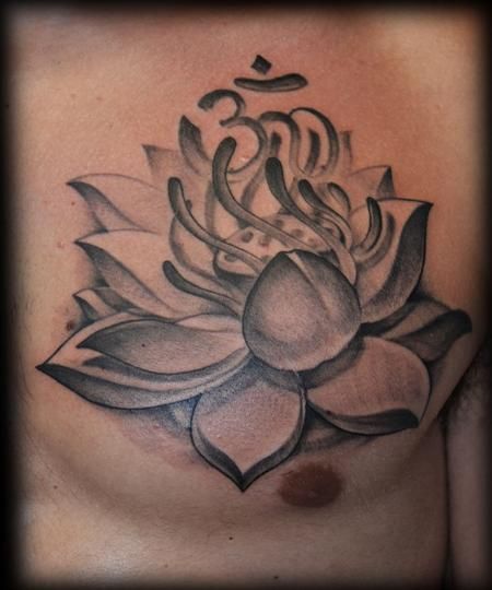 Black And Grey Lotus Flower With Om Tattoo On Man Chest