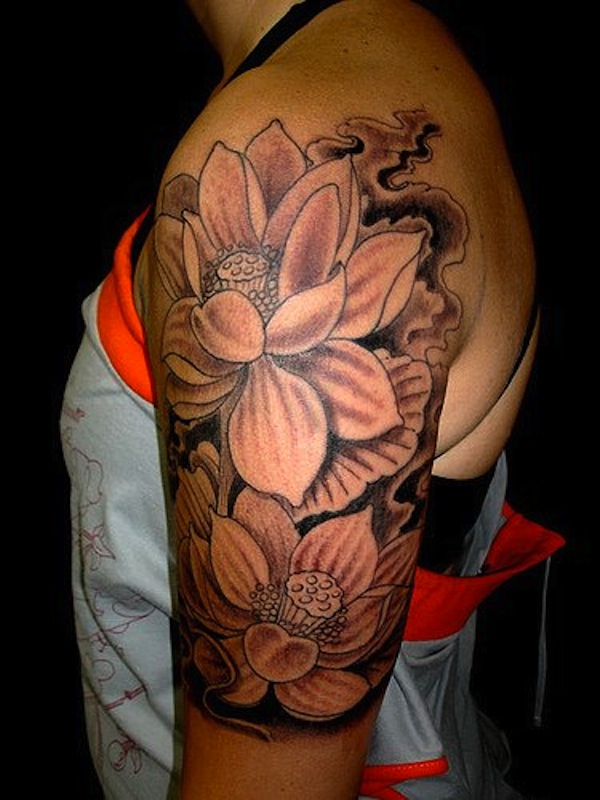 Black And Grey Lotus Flowers Tattoo On Left Half Sleeve