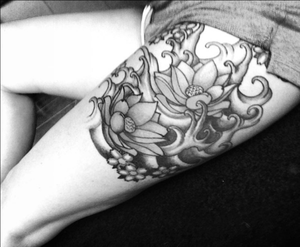 Black And Grey Lotus Flowers Tattoo On Left Side Thigh