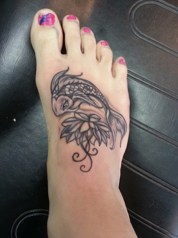 Black And Grey Lotus With Fish Tattoo On Girl Right Foot