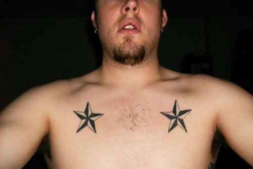 Black And Grey Nautical Star Tattoos On Man Front Shoulders