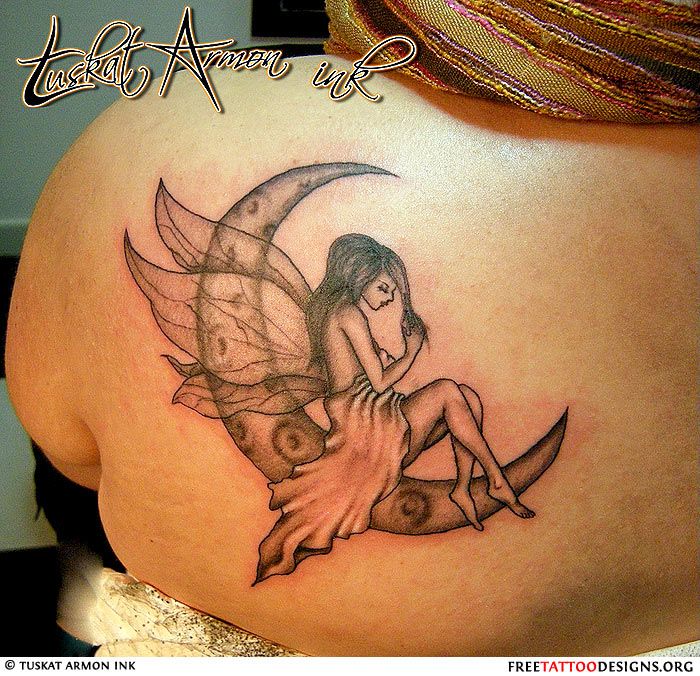 Black And Grey Small Fairy On Half Moon Tattoo On Girl Left Back Shoulder