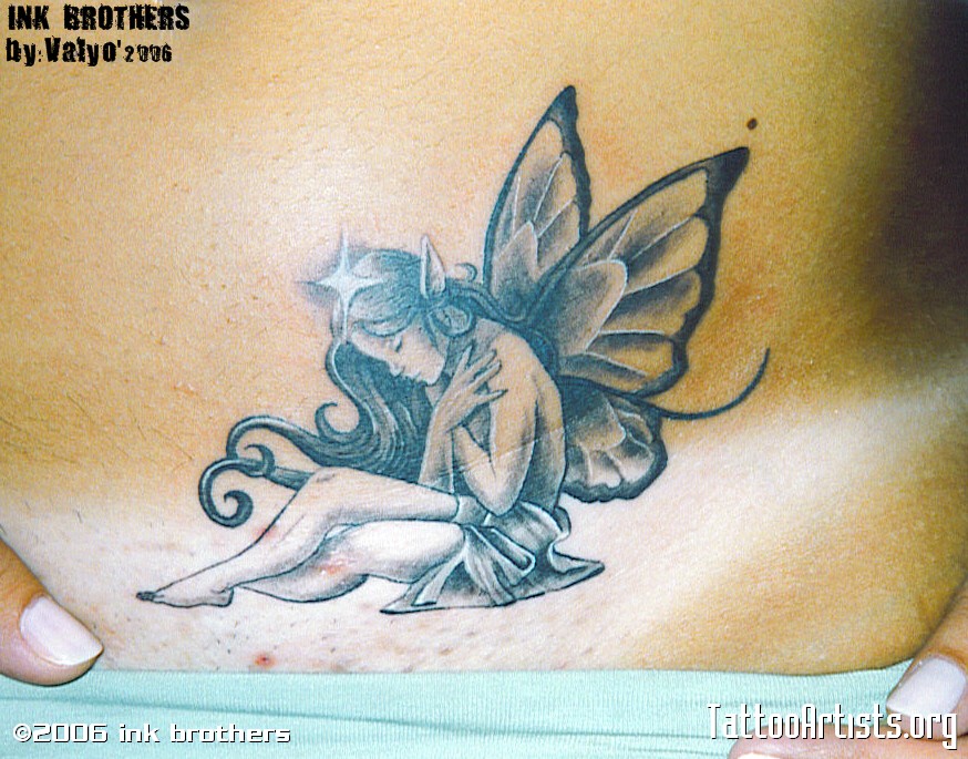 Black And Grey Small Fairy Tattoo Design For Lower Back.