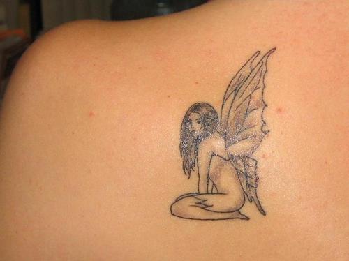 Black And Grey Small Fairy Tattoo On Left Back Shoulder