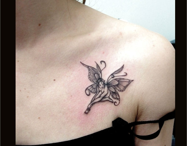 Black And Grey Small Fairy Tattoo On Left Front Shoulder
