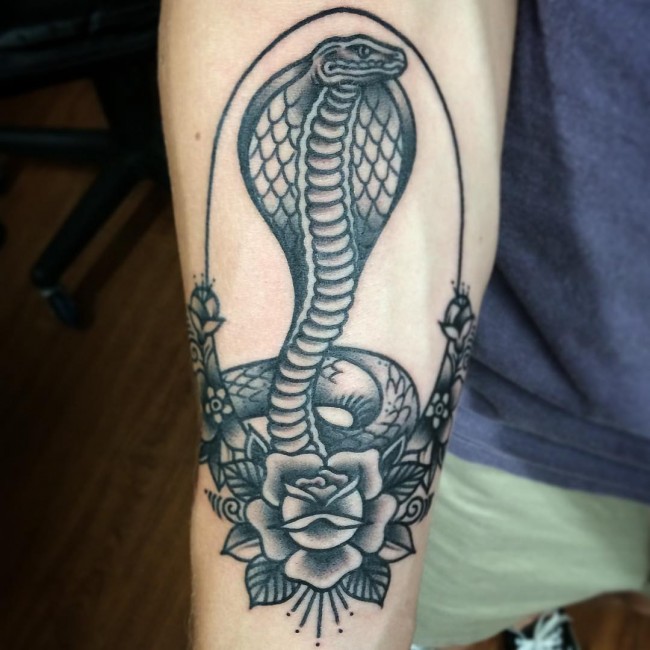 Black And Grey Snake With Rose Tattoo On Right Forearm