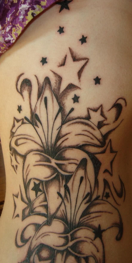 Black And Grey Stars And Lily Tattoo On Side Rib