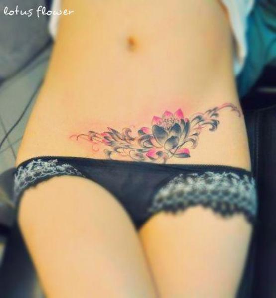 Black And Pink Lotus Flower Tattoo On Girl Hip