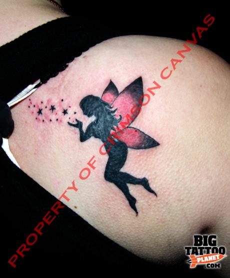 Black And Purple Flying Fairy With Fairy Dust Tattoo On Right Back Shoulder