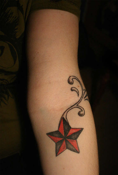 Black And Red Nautical Star Tattoo On Forearm